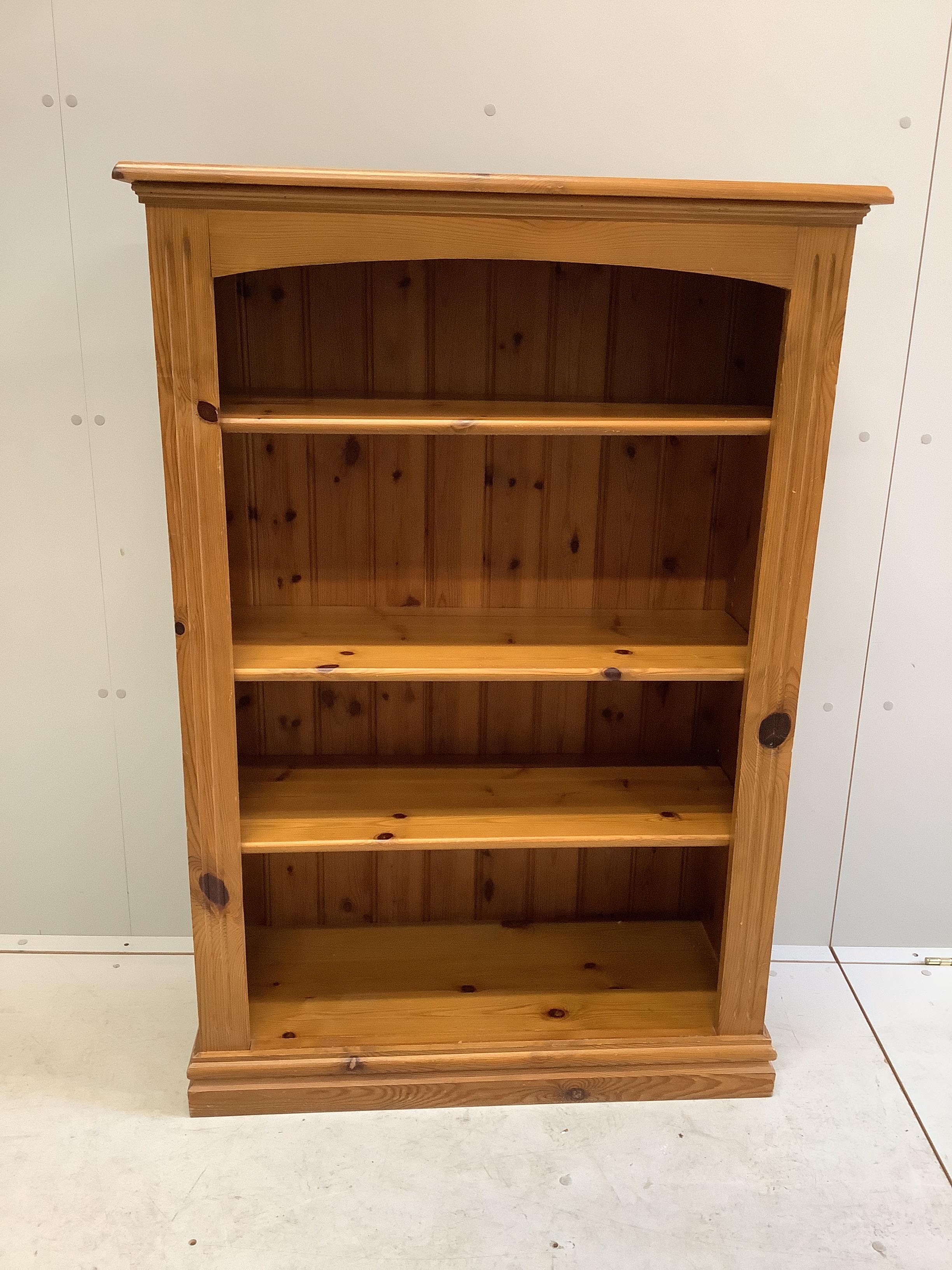 A reproduction pine open fronted bookcase, width 84cm, depth 34cm, height 122cm